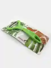 Зеленый овощечистка рогатка