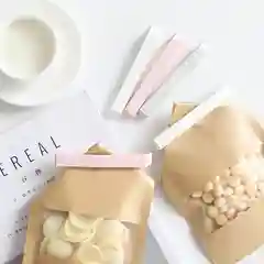 Розовый зажим кухонный для пакета