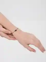 Браслет на нити с бусиной из гематита "Сова"