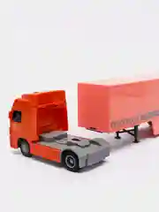 Оранжевый грузовик инерционный