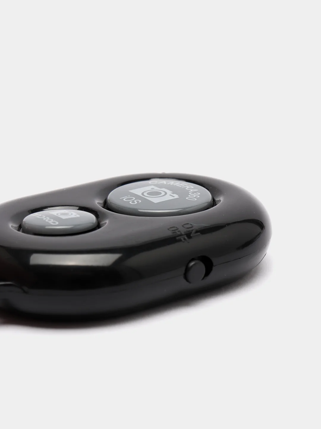 Черный bluetooth-пульт для штативов и телефонов