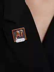 Металлический значок Adobe