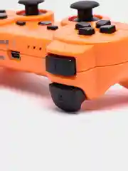 Оранжевый беспроводной геймпад для PS3