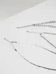 Золотой комплект на шею из металлических цепочек со звездами и звеньями