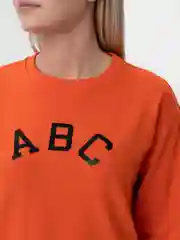 Оранжевый костюм с шортами женский