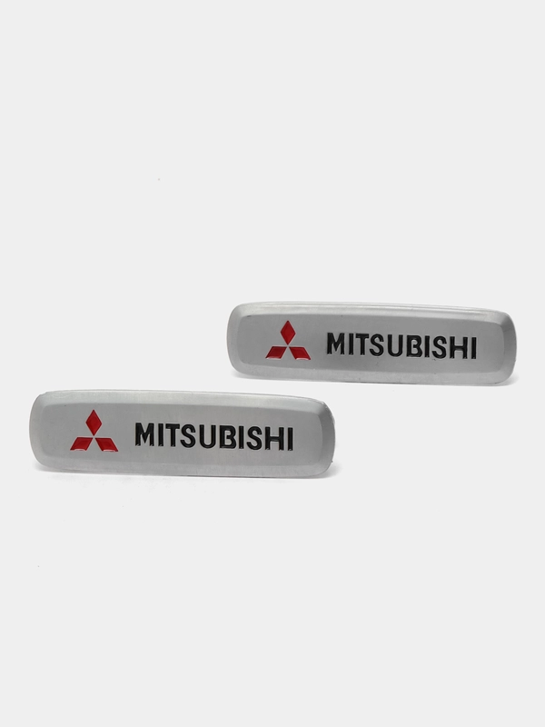 Комплект шильдиков металлических с эмблемой "MITSUBISHI" и 4 винтовыми креплениями (Пара)