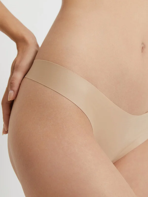 Бежевый трусы стринги с обрезным краем женские  InfinityLingerie