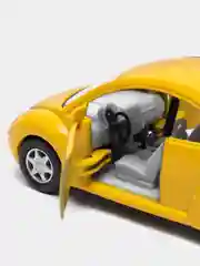 Желтый металлическая машинка Kinsmart "Volkswagen Beetle New", 1:32 KT5028D