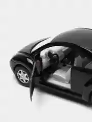 Черный металлическая машинка Kinsmart "Volkswagen Beetle New", 1:32 KT5028D