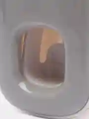 Серый настенный дозатор для зубной пасты