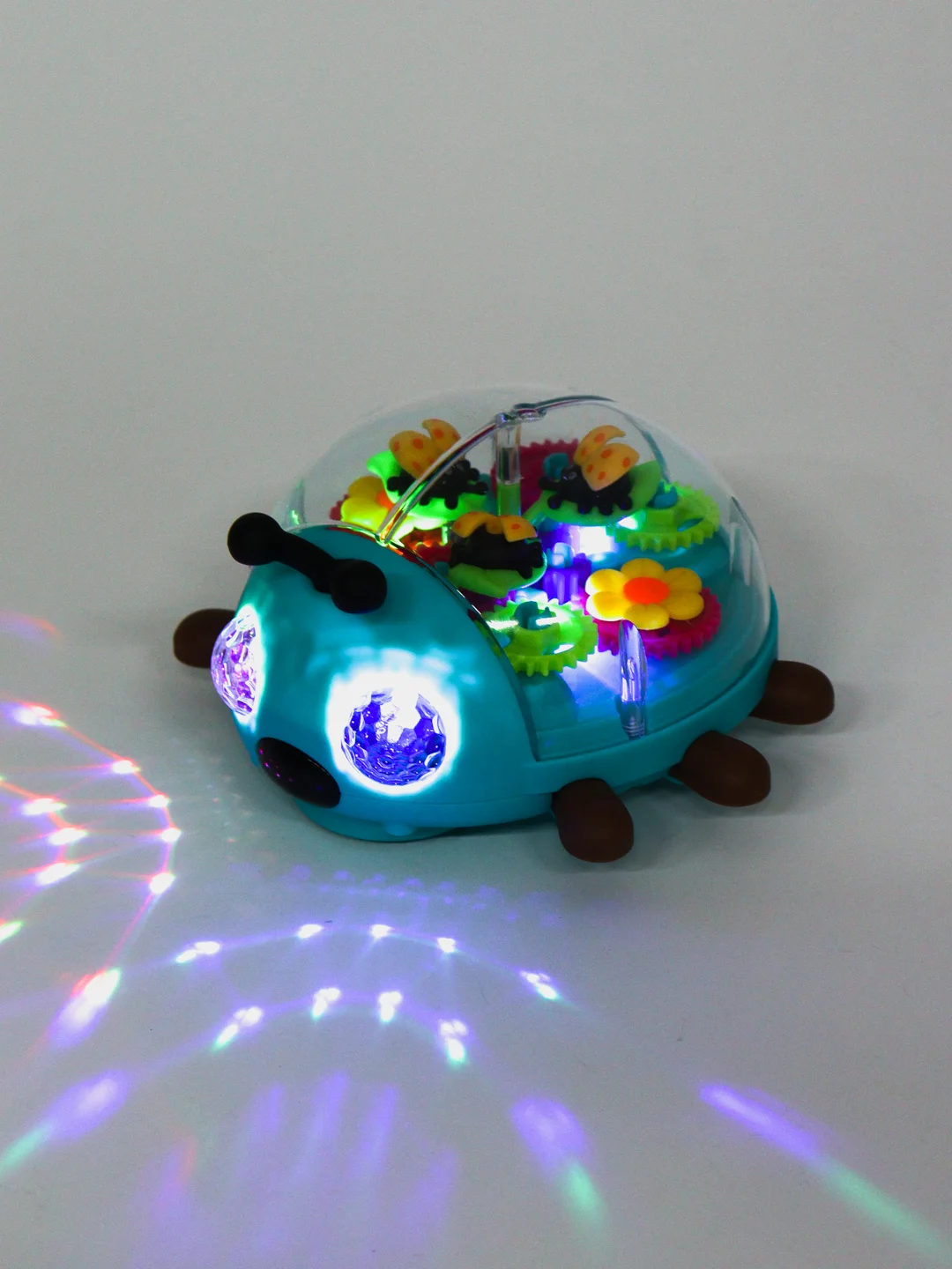 Музыкальная игрушка с шестеренками Божья коровка, со светом