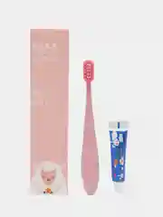Розовый детская зубная щетка и зубная паста